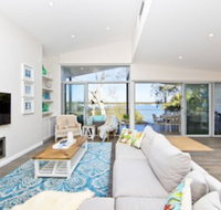 Hamptons Coastline Retreat Waterfront with a Heated Pool