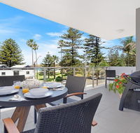 Bathers at the Beach - across from Surf Beach - Accommodation Mermaid Beach